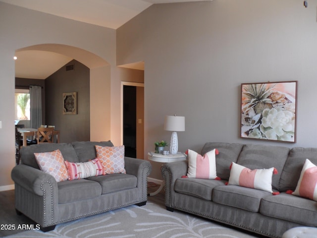 1333 N Higley Rd Unit 7, Mesa, AZ 85205 - living area with vaulted ceiling, arched walkways, and baseboards