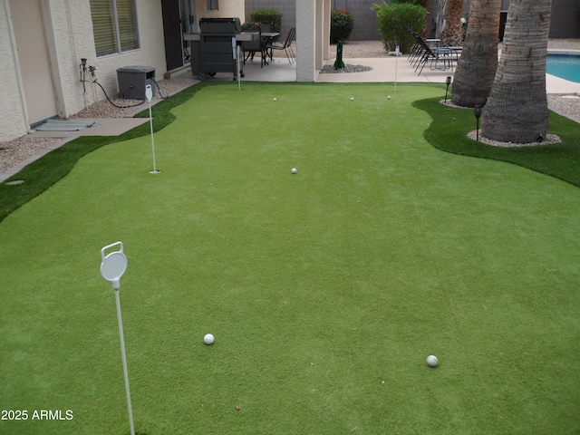 1333 N Higley Rd Unit 7, Mesa, AZ 85205 - view of yard featuring a putting green and a patio