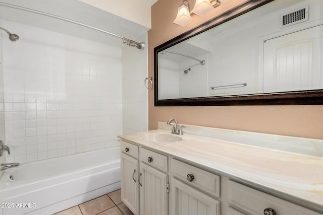 full bath featuring shower / bath combination, tile patterned flooring, visible vents, and vanity