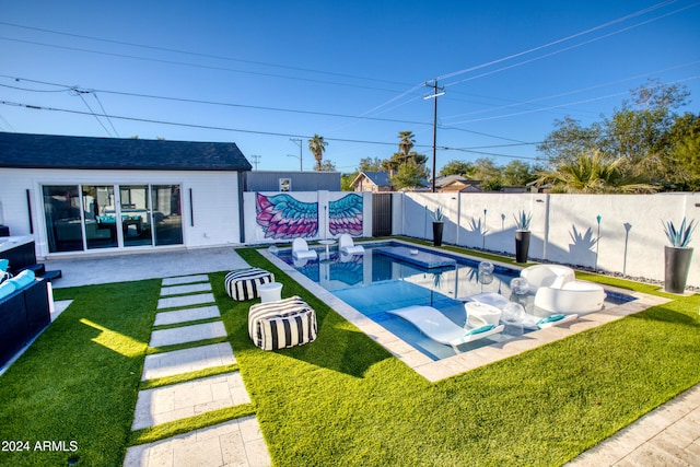 view of pool featuring a lawn and a patio area