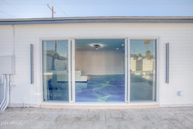 doorway to property with a patio