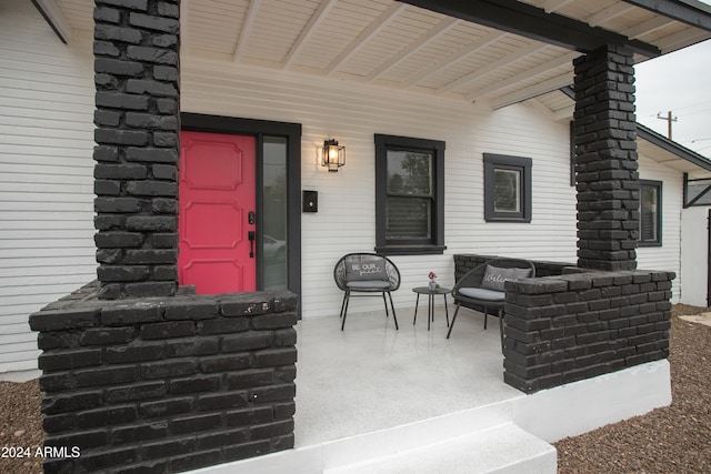 doorway to property with a porch