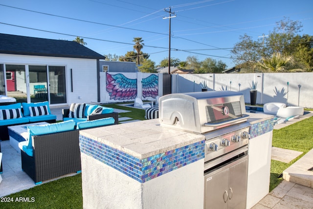 view of patio / terrace with area for grilling, an outdoor living space, and grilling area