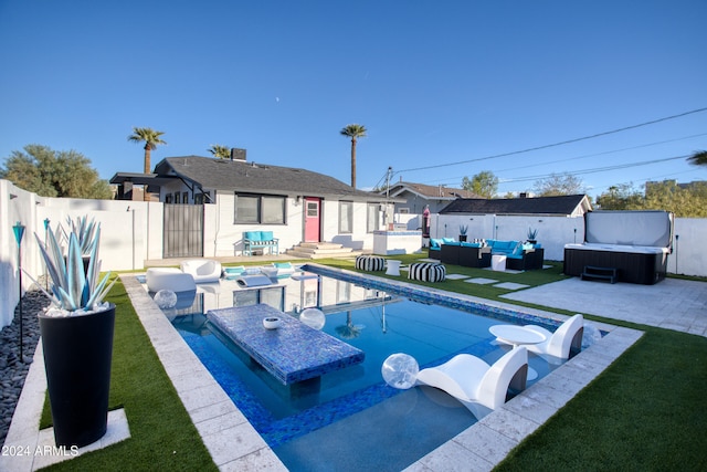 view of swimming pool featuring an outdoor living space, a patio, and a hot tub