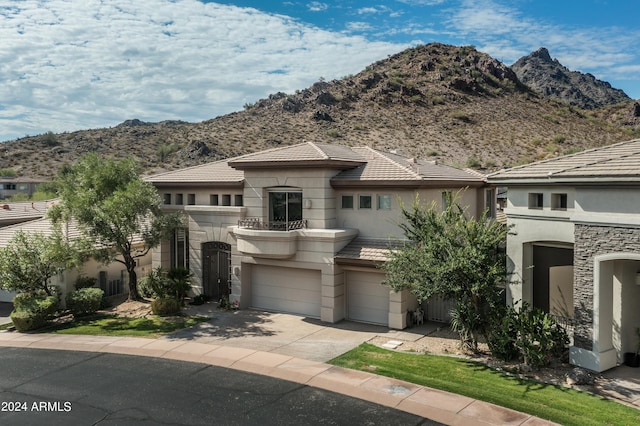 view of front of house with a mountain view and a garage