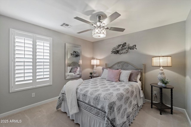carpeted bedroom with baseboards and ceiling fan