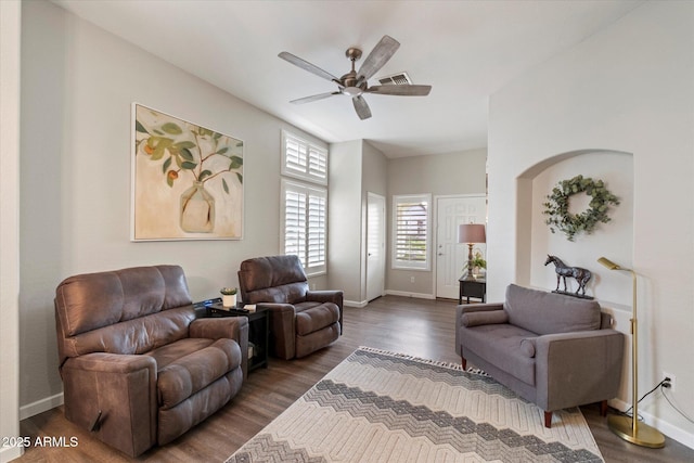 living room with wood finished floors, ceiling fan, and baseboards