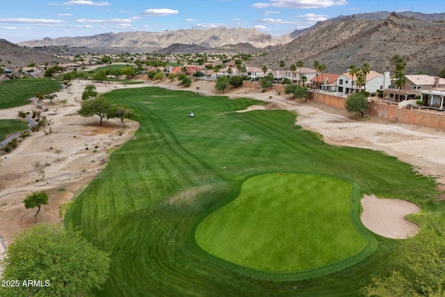 view of community with a residential view, a mountain view, golf course view, and fence