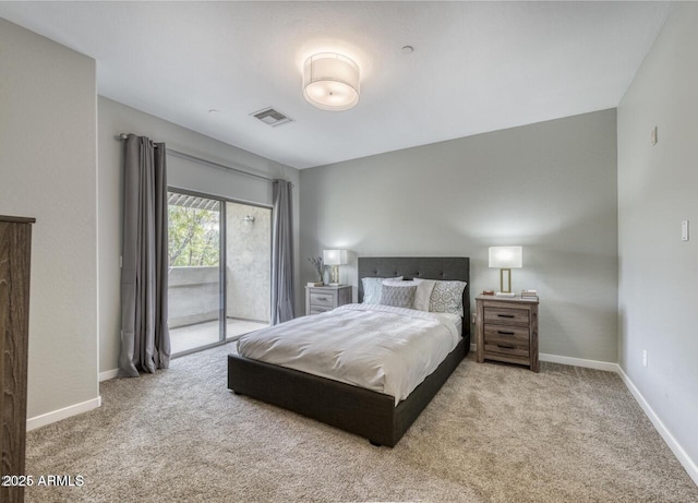 815 E Rose Ln Unit 105, Phoenix, AZ 85014 - bedroom with access to outside, baseboards, visible vents, and carpet floors