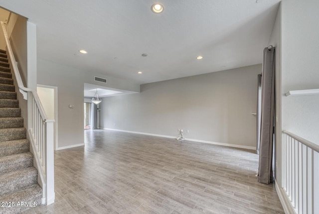 815 E Rose Ln Unit 105, Phoenix, AZ 85014 - empty room featuring recessed lighting, light wood-style floors, and stairs