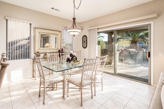 dining area with light tile patterned flooring