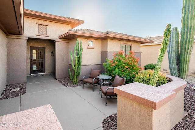 doorway to property featuring a patio area