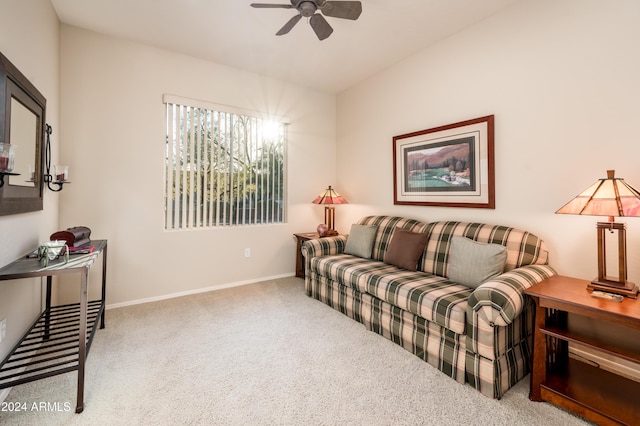 living room featuring light carpet and ceiling fan