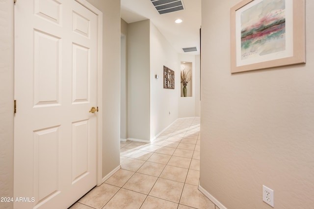 hallway with light tile patterned floors