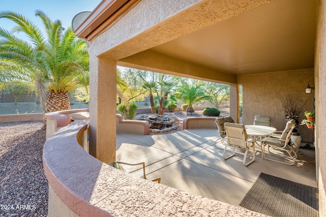 view of patio with a water view