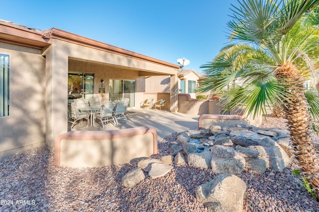 rear view of house featuring a patio area