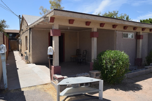 back of property featuring a patio area