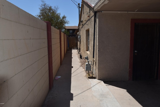 view of side of property with a patio