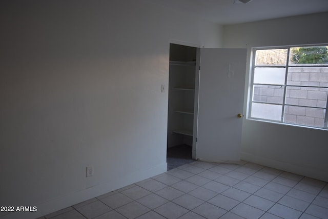 empty room with light tile flooring