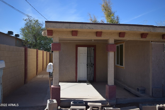 entrance to property with a patio area