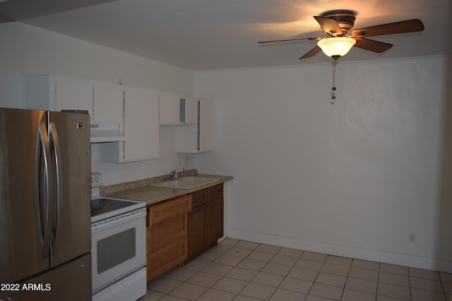 kitchen featuring custom exhaust hood, electric range, white cabinetry, stainless steel refrigerator, and sink