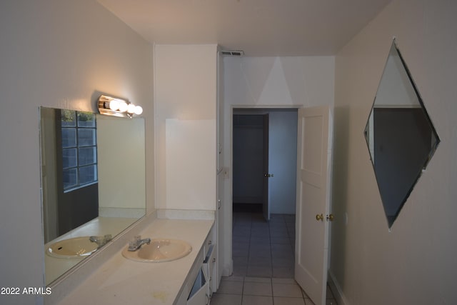 bathroom with vanity and tile floors