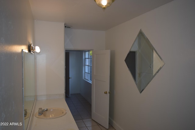 bathroom with tile floors and vanity