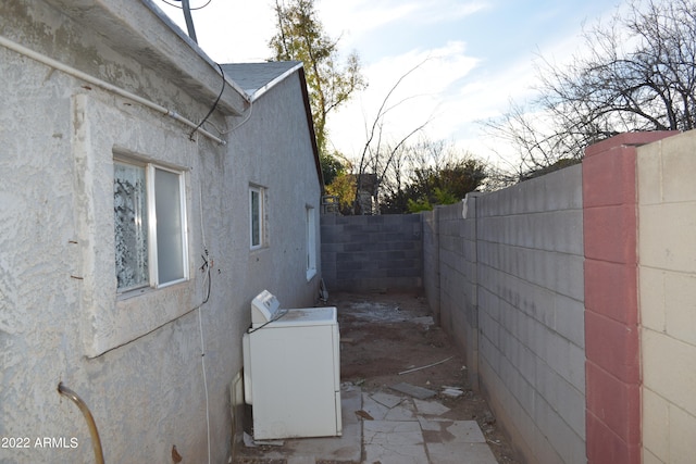 view of home's exterior featuring washer / clothes dryer