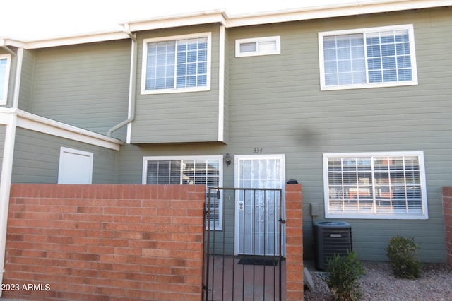 2301 E University Dr Unit 334, Mesa, AZ 85213 - rear view of property with a gate and central AC