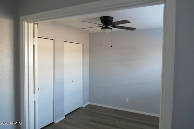 2301 E University Dr Unit 334, Mesa, AZ 85213 - unfurnished bedroom featuring dark wood-type flooring and baseboards