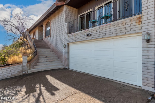 11237 N 15th Ln, Phoenix, AZ 85029 - view of home's exterior featuring brick siding, an attached garage, stairs, and driveway