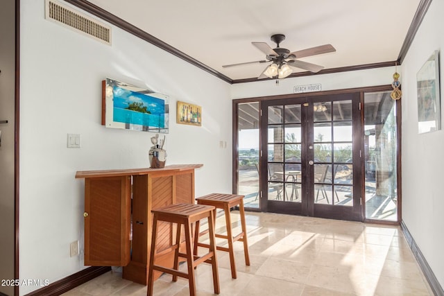 11237 N 15th Ln, Phoenix, AZ 85029 - doorway with french doors, baseboards, crown molding, and a ceiling fan