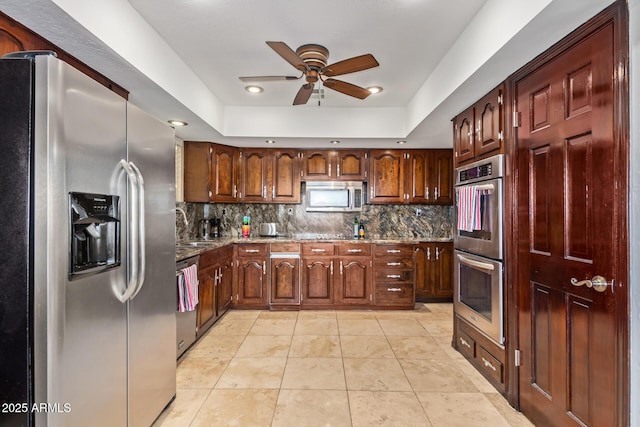 11237 N 15th Ln, Phoenix, AZ 85029 - kitchen with appliances with stainless steel finishes, a ceiling fan, decorative backsplash, stone countertops, and a sink