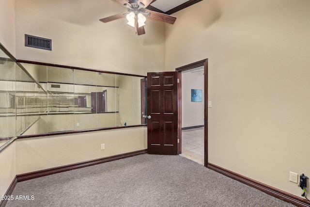 11237 N 15th Ln, Phoenix, AZ 85029 - carpeted spare room with ceiling fan, baseboards, and a high ceiling