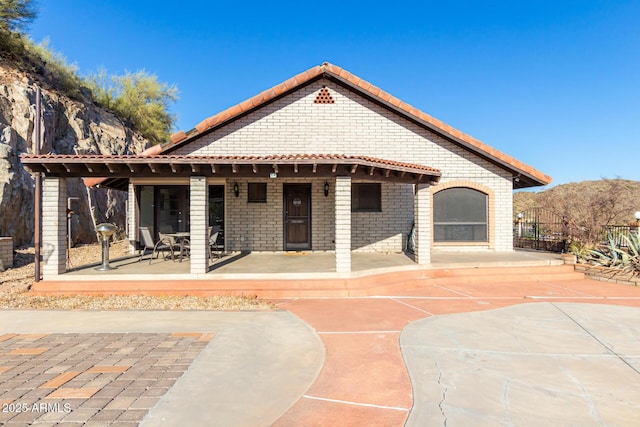 11237 N 15th Ln, Phoenix, AZ 85029 - back of house featuring a tiled roof and brick siding