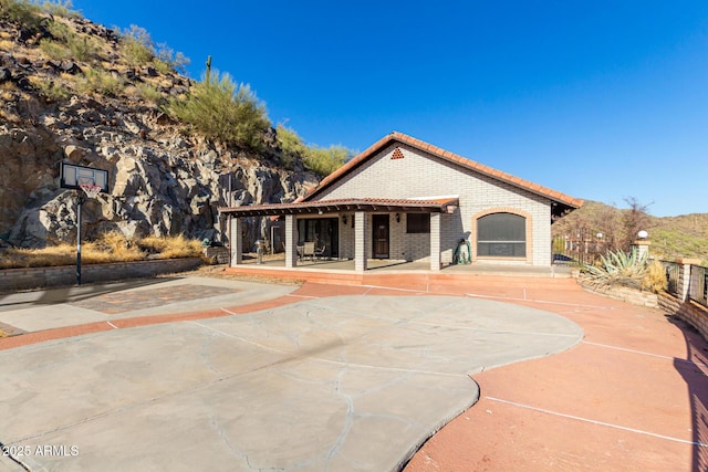 11237 N 15th Ln, Phoenix, AZ 85029 - back of property featuring a tile roof, basketball court, and brick siding