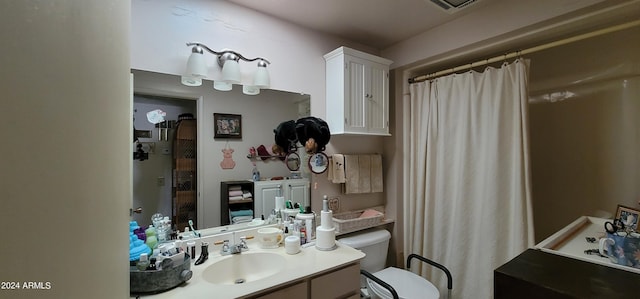 bathroom featuring toilet and oversized vanity