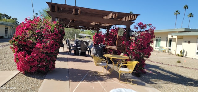 view of terrace with a pergola