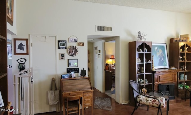 living area featuring a textured ceiling