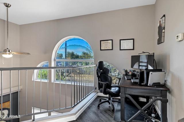 office space with a ceiling fan and wood finished floors