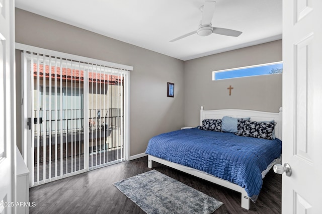 bedroom featuring ceiling fan, baseboards, and wood finished floors