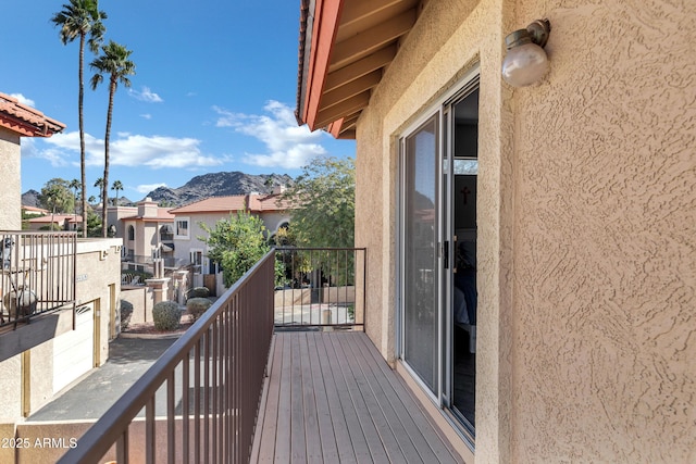 balcony with a residential view and a mountain view