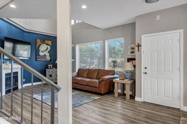 living room with stairway, baseboards, wood finished floors, and recessed lighting