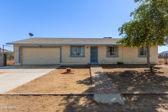 single story home with a garage