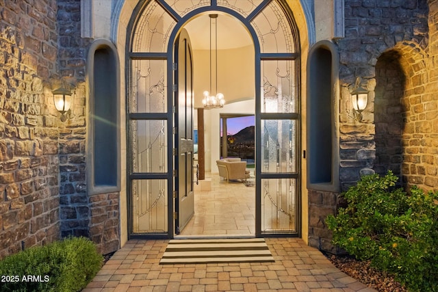 doorway to property featuring stone siding