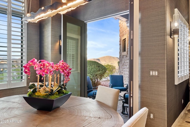 interior space with a mountain view and a healthy amount of sunlight