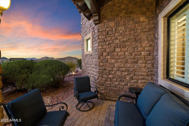 view of patio / terrace featuring a mountain view