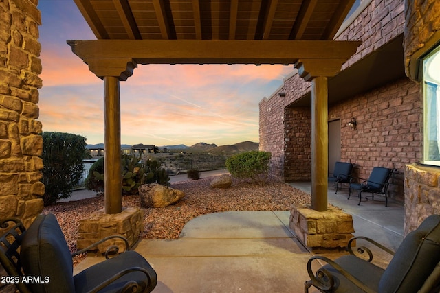 patio terrace at dusk with a mountain view
