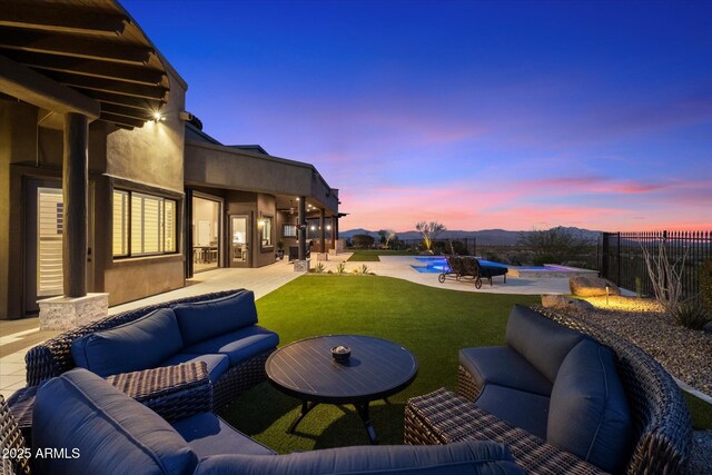 view of patio featuring outdoor lounge area, fence, and an outdoor pool