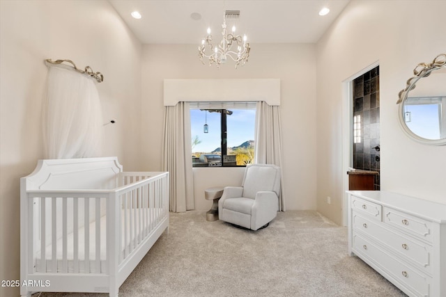 bedroom featuring a crib, a chandelier, light colored carpet, visible vents, and recessed lighting